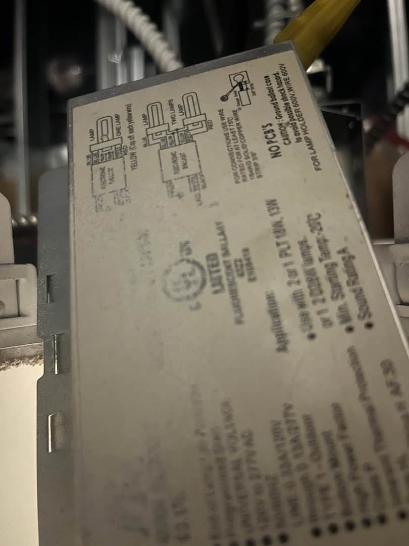 Close-up of LED pot light retrofit electrical component in condo lighting system.
