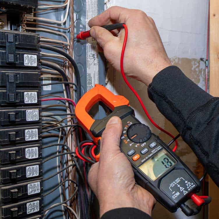 Photo of Electrician troubleshooting an electrical panel in East York